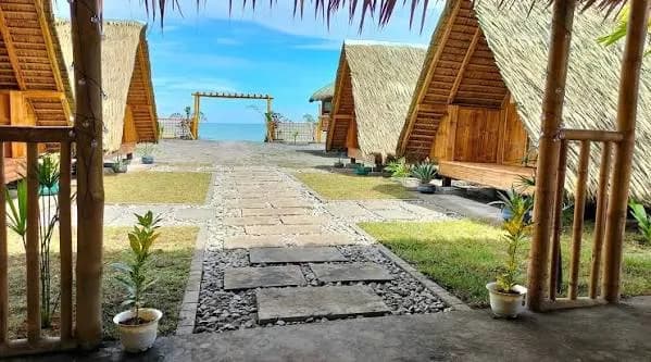 Tents pitched by the shore at Beach Camp by LOC in Caba