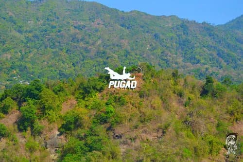 The hillside PUGAD sign at Pugo Adventure
