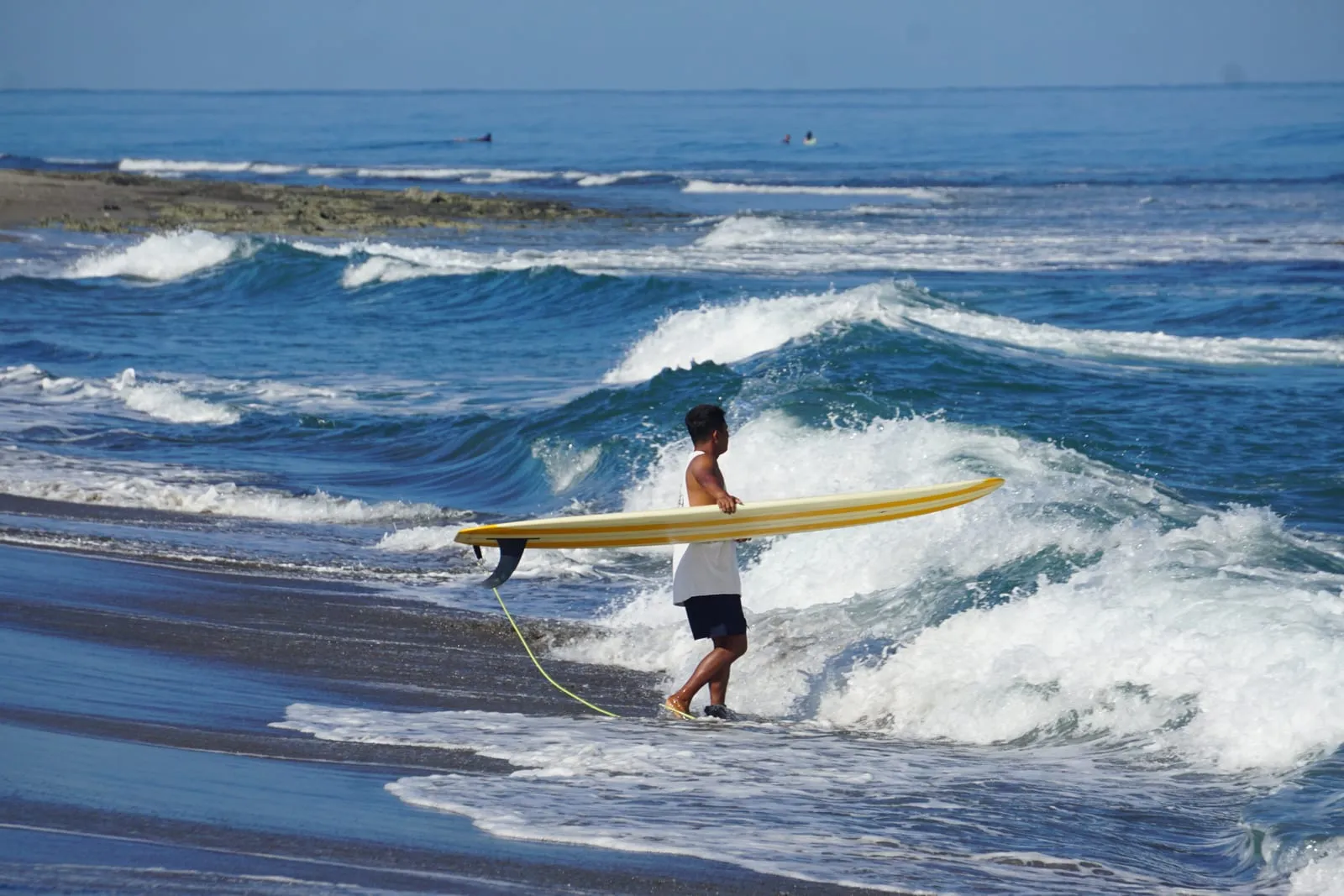 A surfer at Urbiztondo Beach in San Juan, La Union